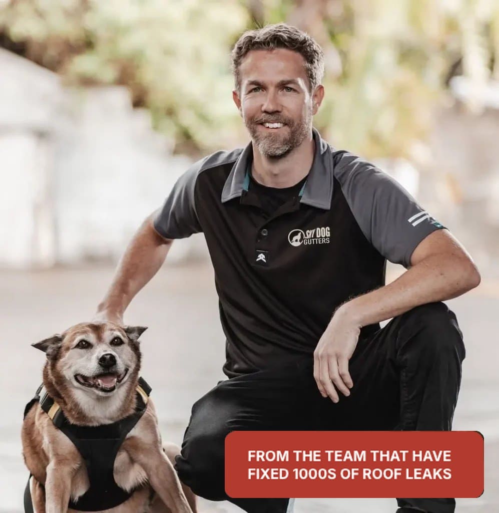Sky Dog Gutter Care team member kneeling with the Sky Dog dog